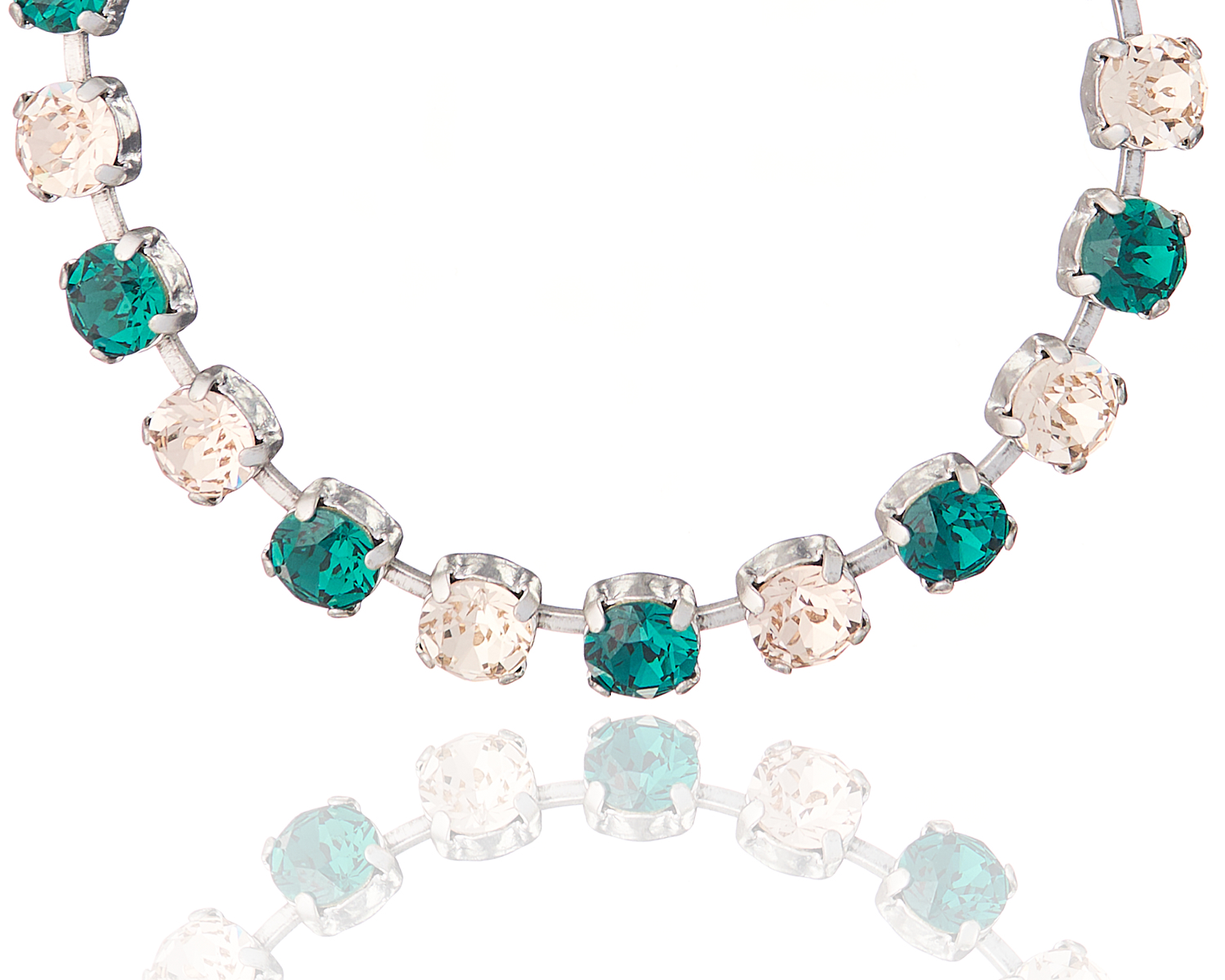 Cupchain with Crystals – Rhodium Emerald and Golden Shadow Close-up of a rhodium cupchain bracelet with emerald and golden shadow crystals.